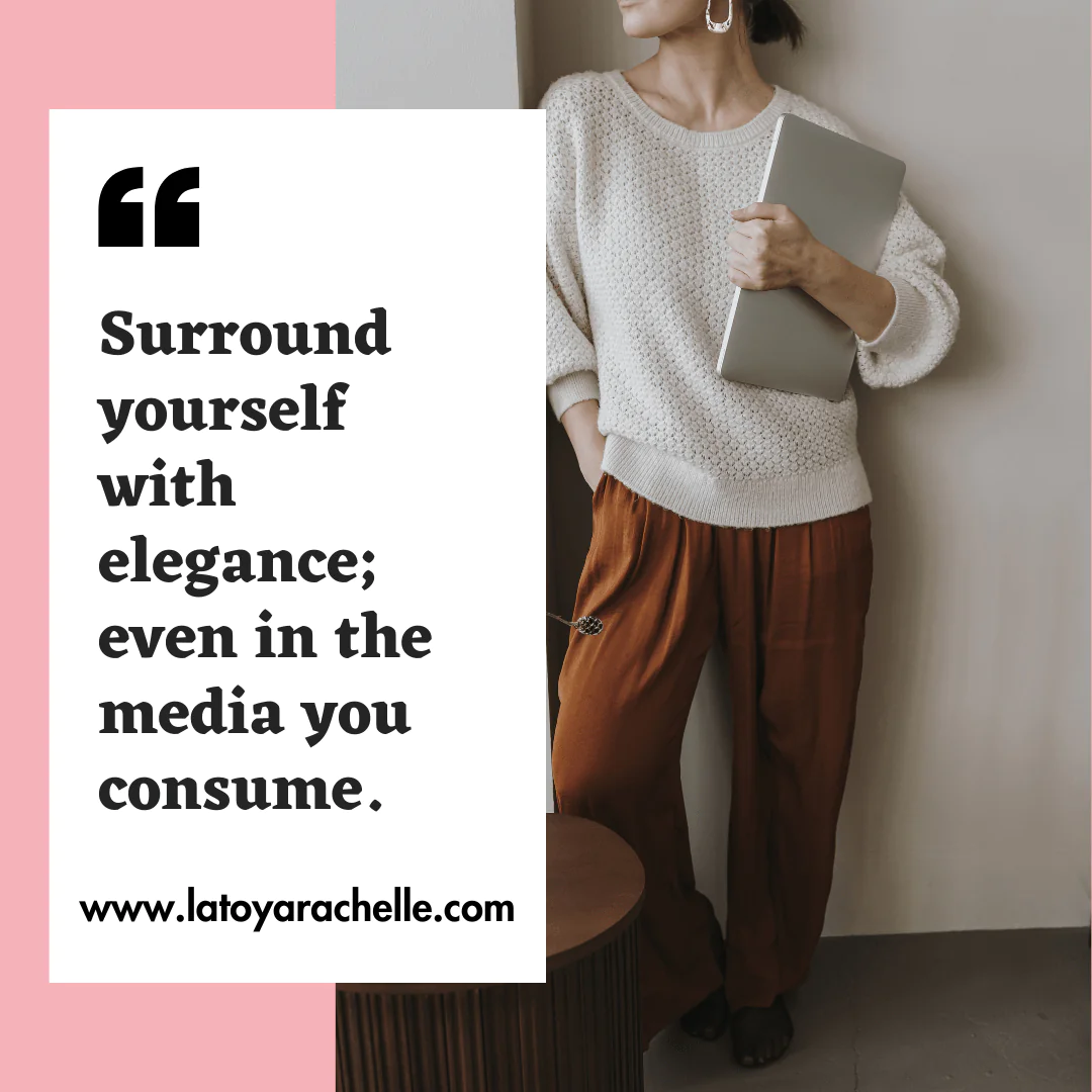 Stylish woman in a textured white sweater and rust-colored trousers holding a laptop stands next to a quote on a pink and white background: 'Surround yourself with elegance; even in the media you consume.' - www.latoyarachelle.com.