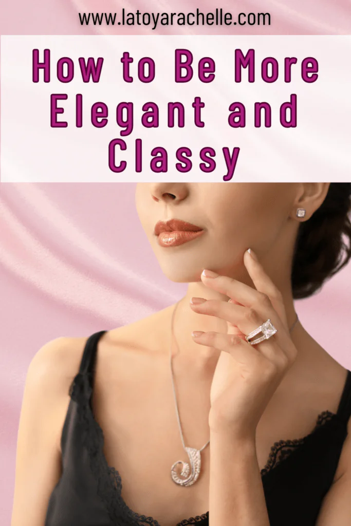 Promotional Pinterest image for a blog post featuring a close-up of a woman adorned in elegant jewelry. She wears a diamond ring, a pearl necklace, and diamond earrings, complementing her subtle makeup and polished fingernails. Text overlay reads 'How to Be More Elegant and Classy' with the website 'www.latoyarachelle.com'.